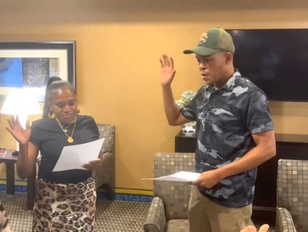 Madam President Leyla Kikuzi being sworn in by Election Commission Chairman Nickson Mlay